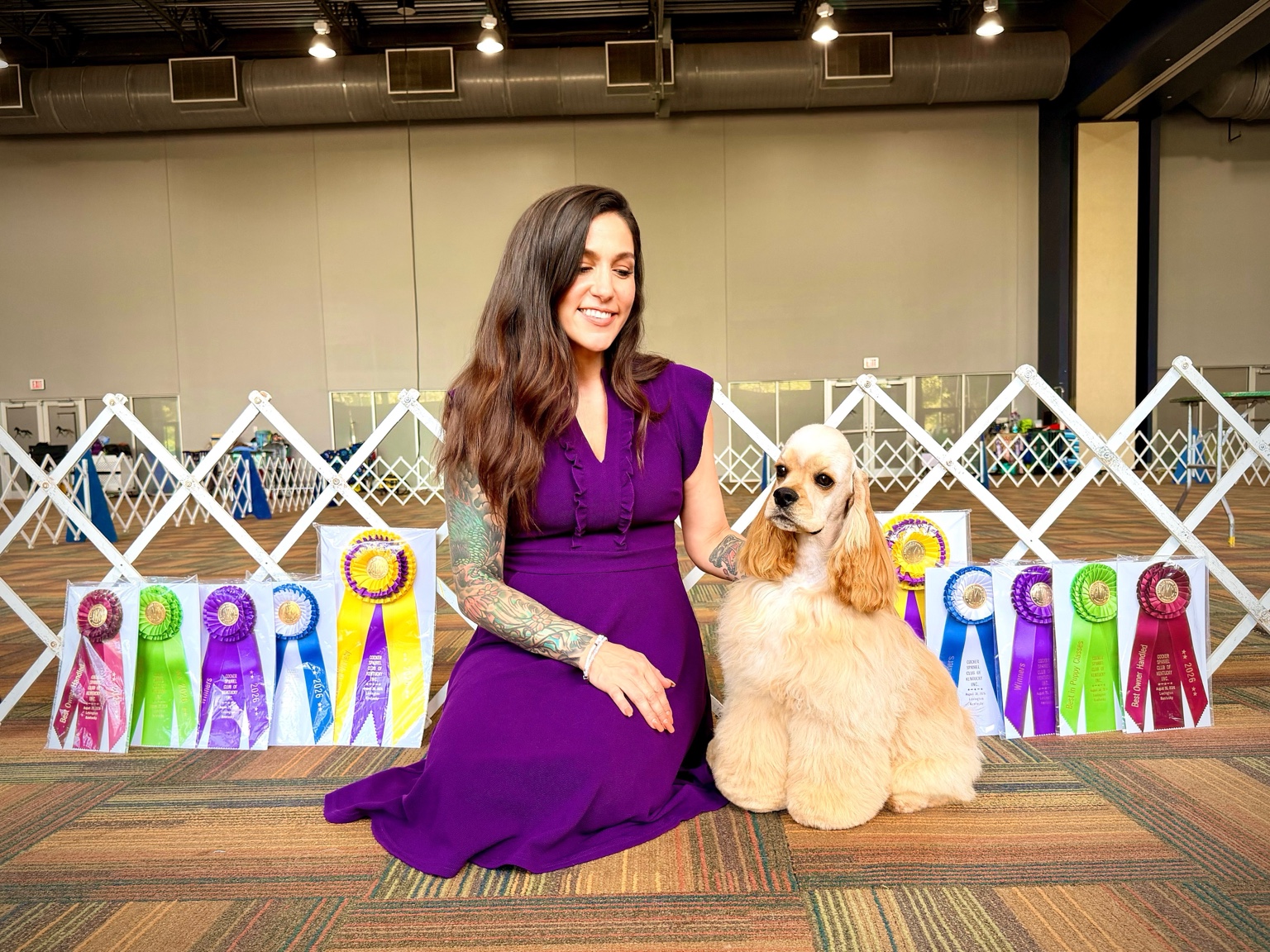 Mackensie with an American Cocker Spaniel and award ribbons