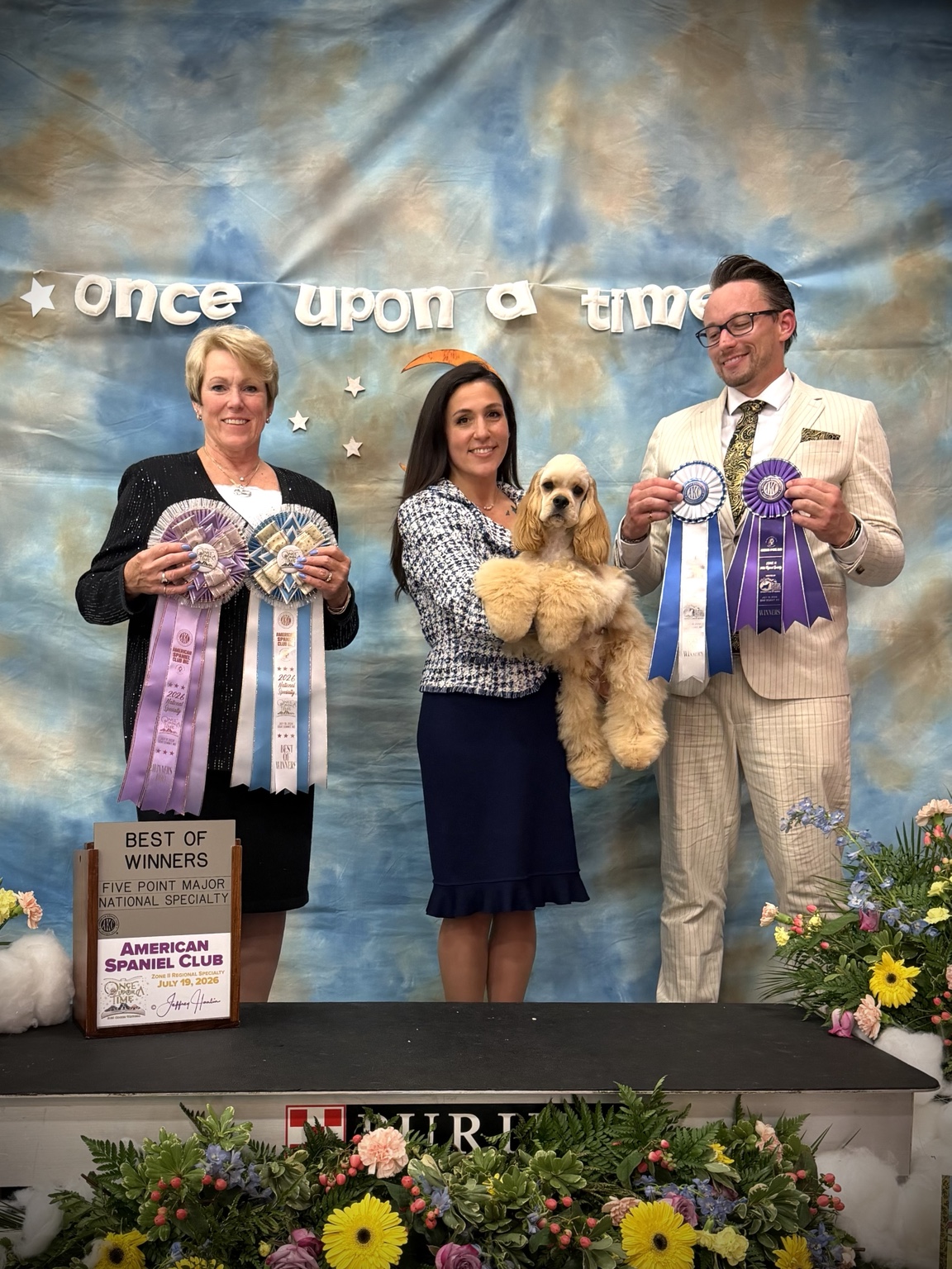 Mackensie with a young American Cocker Spaniel at a specialty show